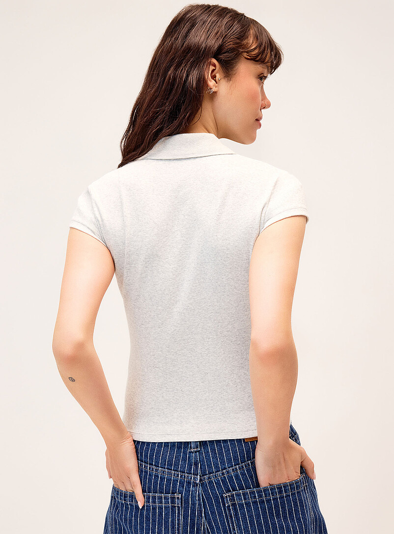 Twik: Le polo ajust&eacute; uni Noir pour femme