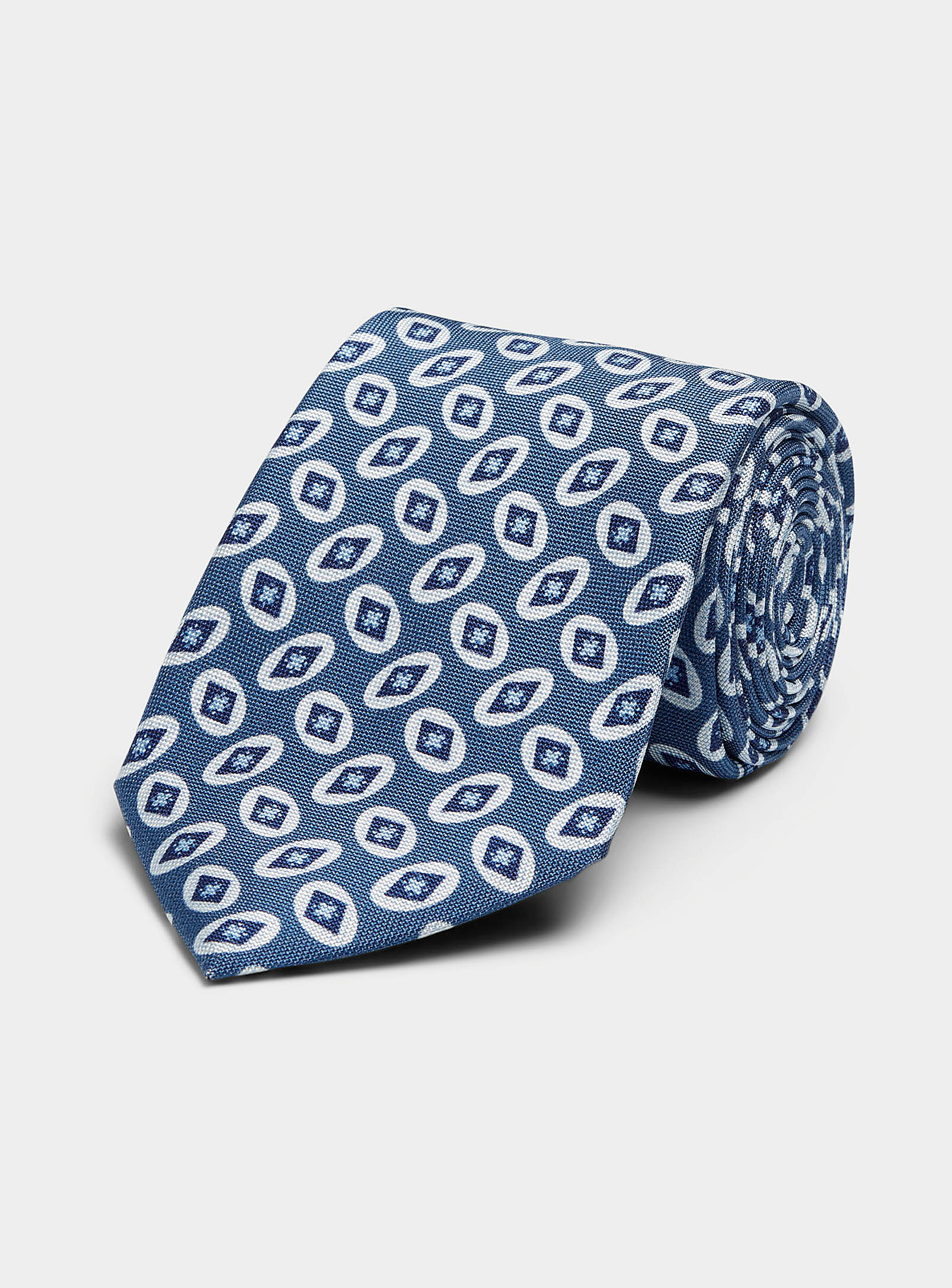 Blick - La cravate bleue ocelles géo