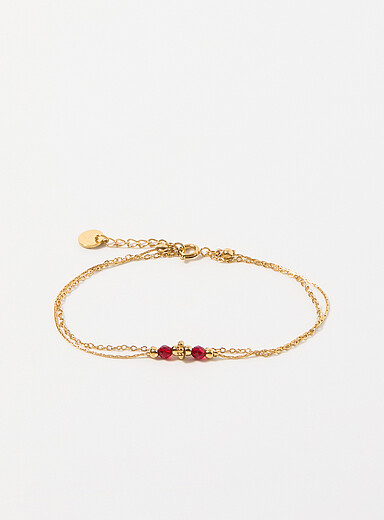 Le bracelet double cha&icirc;nette avec billes facett&eacute;es 