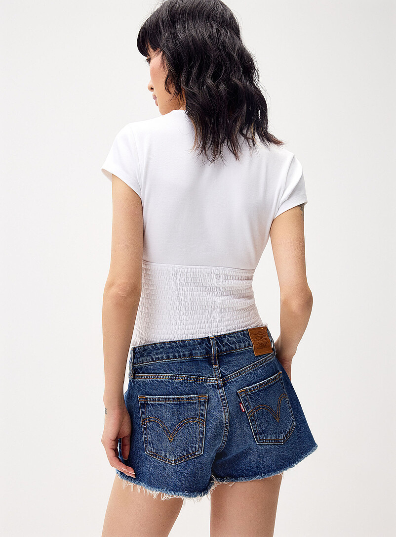 Levi's Medium Wash Frayed hem low-rise short for women