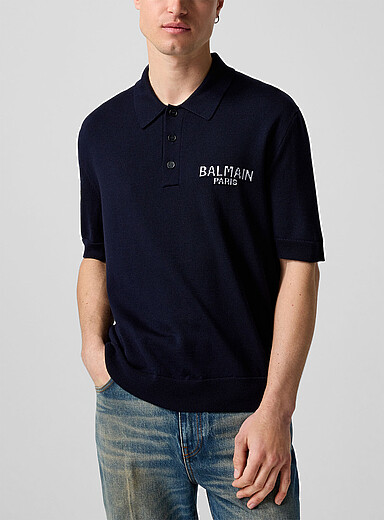 Le polo tricot pur m&eacute;rinos logo jacquard