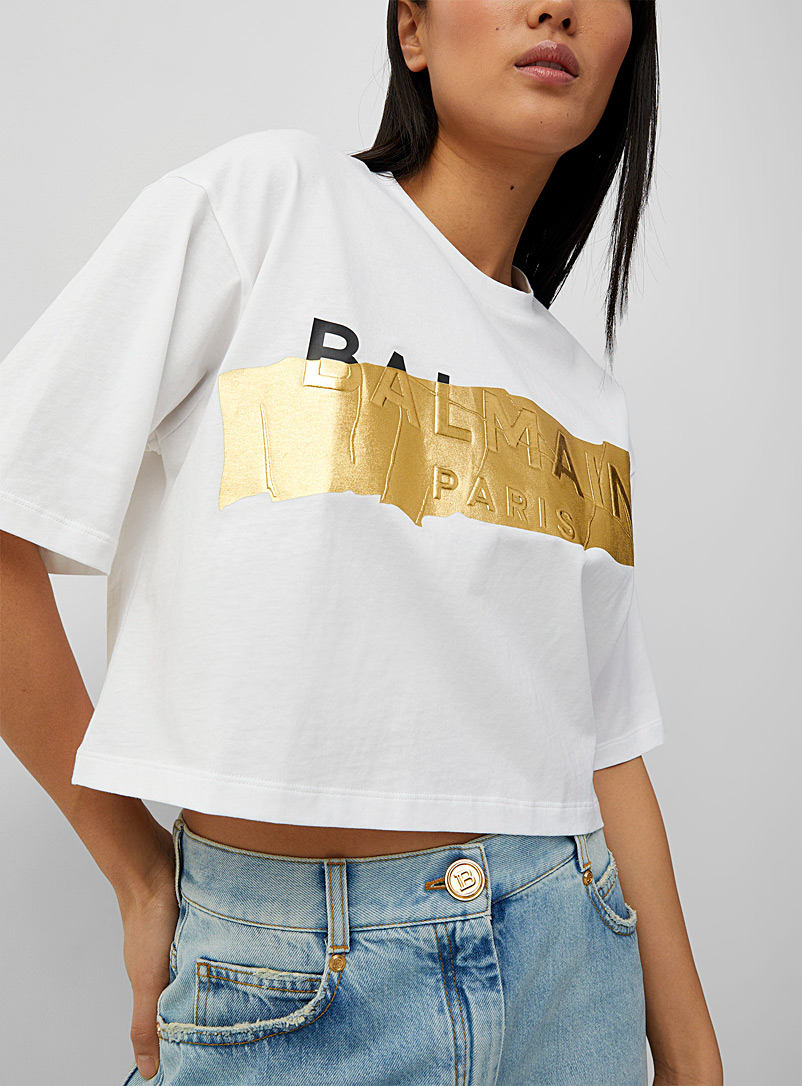 Balmain: Le t-shirt court logo doré Blanc pour femme