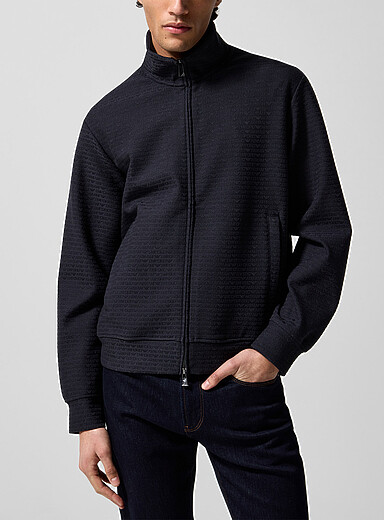 La veste <i>track</i> logos emboss&eacute;s