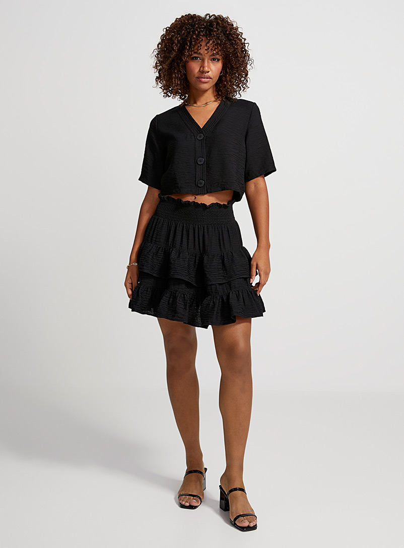 Icône Black Smocked ruffled miniskirt for women