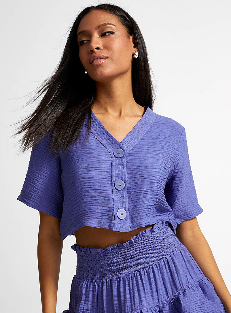 Icône Blue Cropped and loose V-neck blouse for women