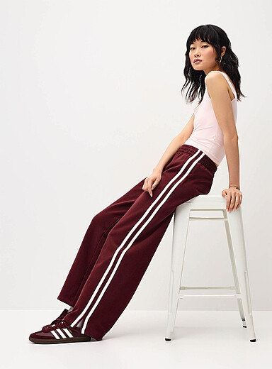 Twik: Le pantalon sweat large rayures <i>track</i> Bourgogne pour femme