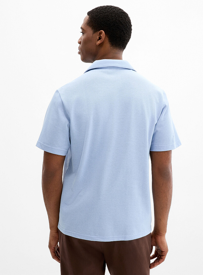 Lacoste: Le polo col Johnny maille piqu&eacute;e <b>Coupe classique</b> Bleu p&acirc;le - Bleu ciel pour homme