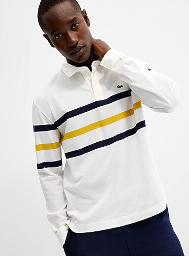 Lacoste: Le polo rugby maille piqu&eacute;e bloc ray&eacute; Blanc pour homme