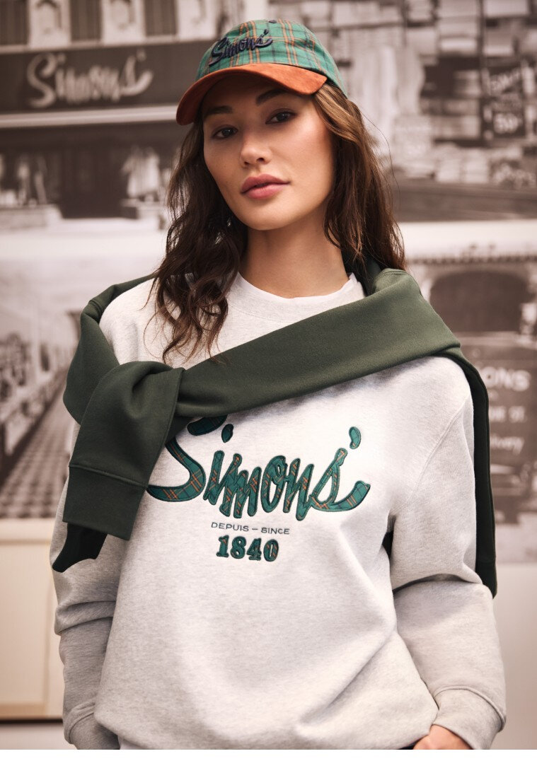 Woman wearing a signature sweatshirt