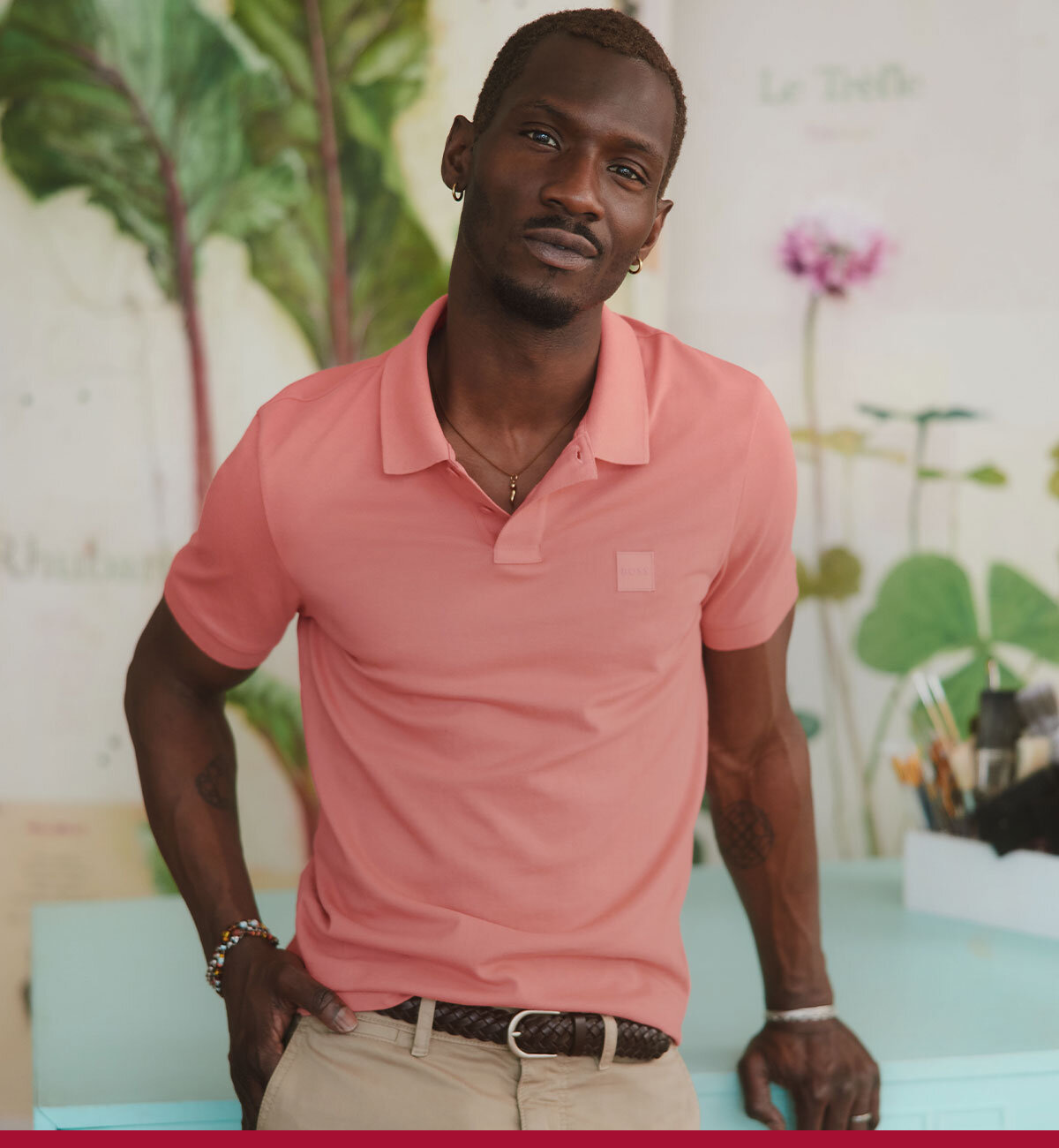 Man wearing a coral pink polo