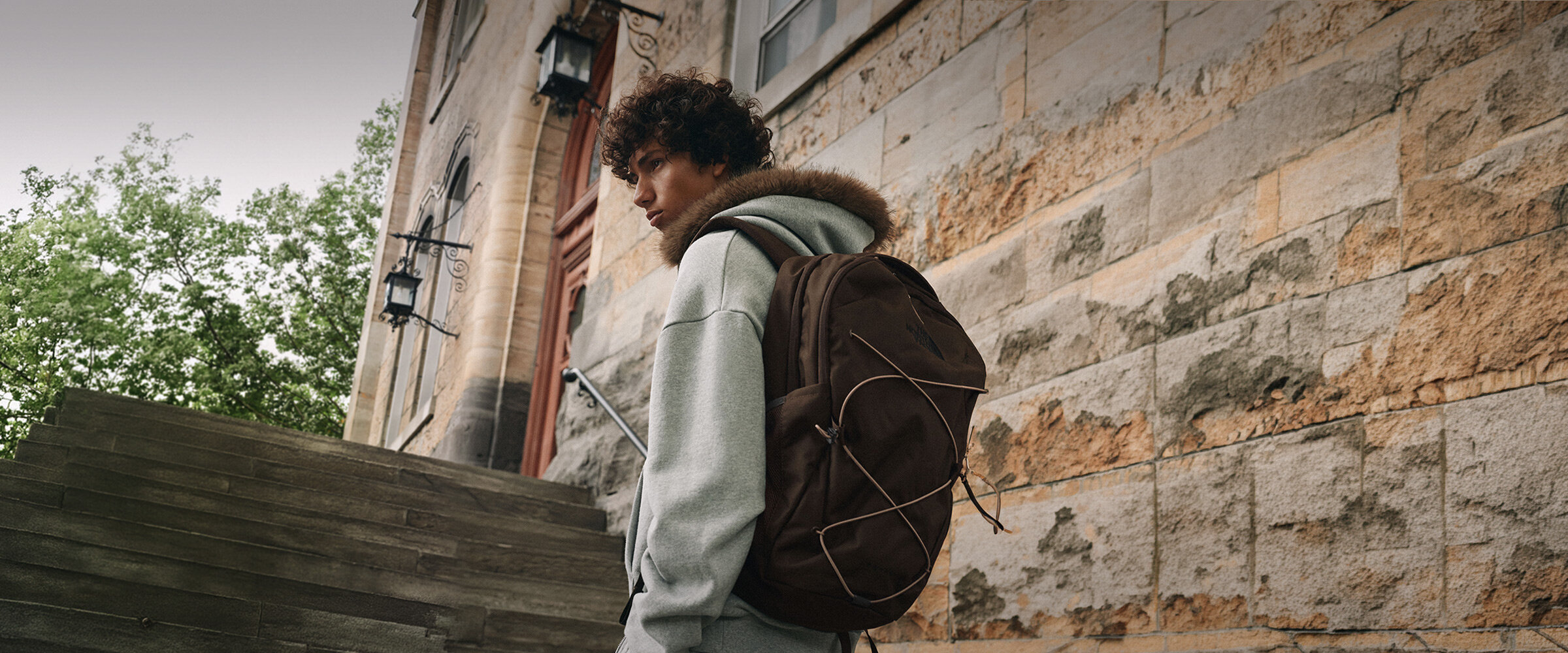 A man wearing a brown backpack