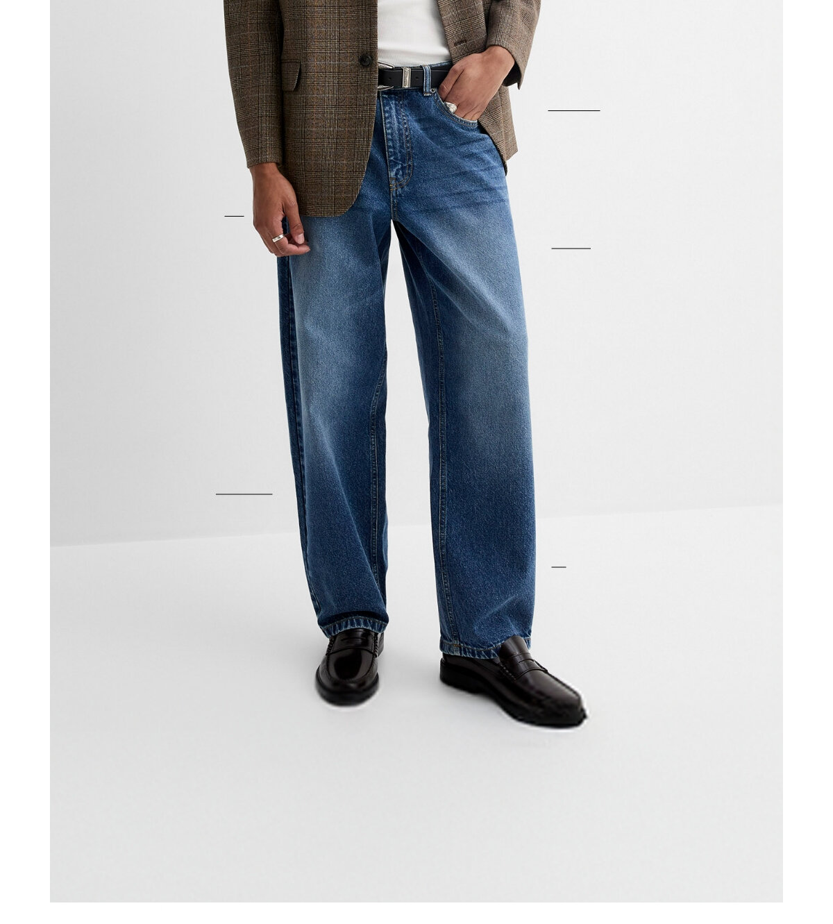 Low waist, drop crotch, loose hip and thigh, and wide, slightly tapered leg