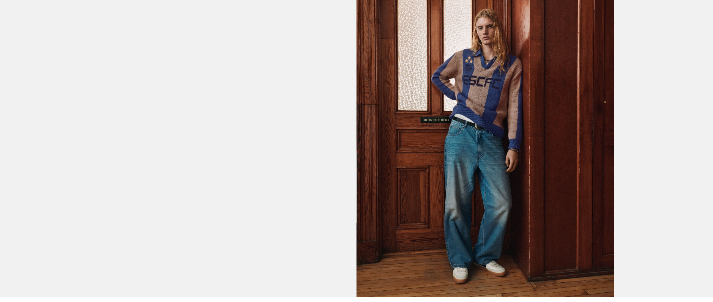 A young man wearing the Camden jeans in a medium blue wash