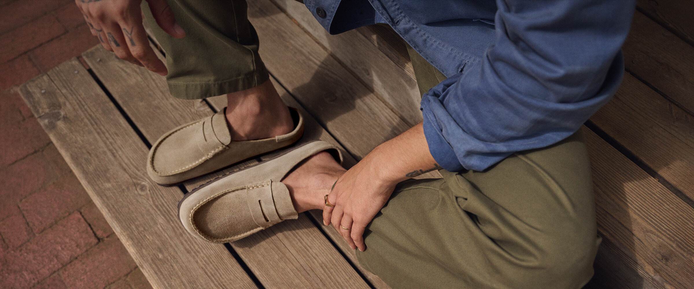 A man wearing Birkentstock Naples Wrapped suede loafers