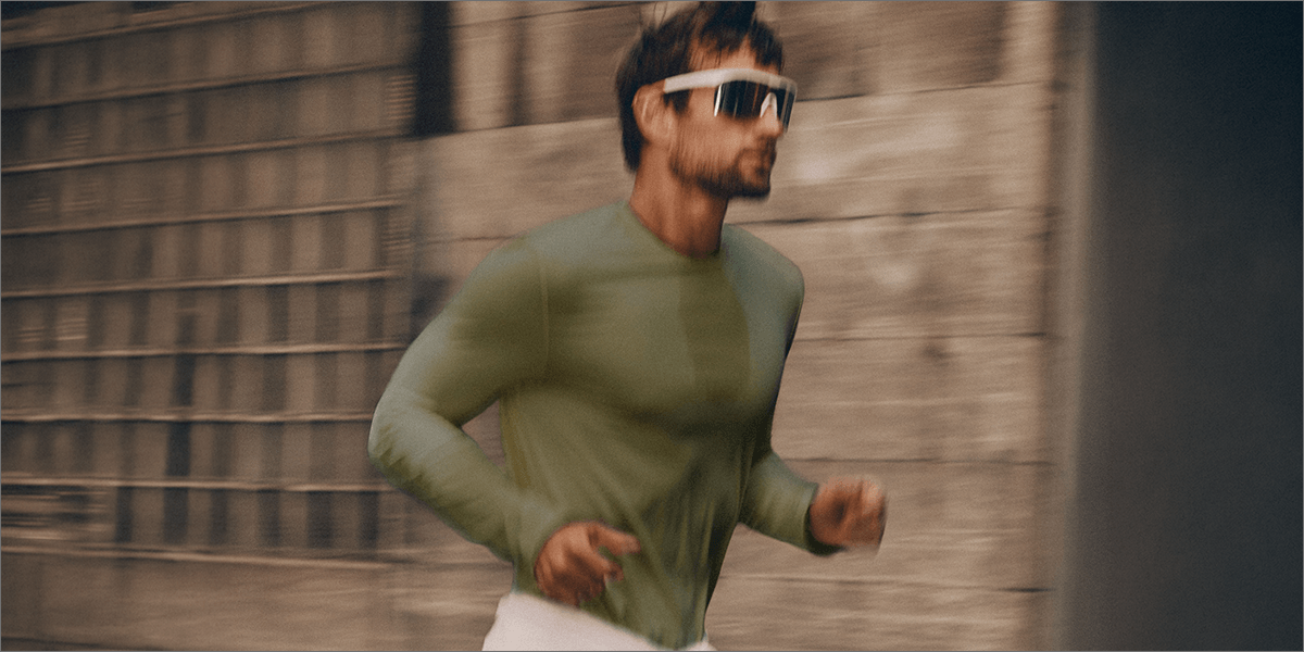 Man running on the street wearing a green long-sleeve T-shirt