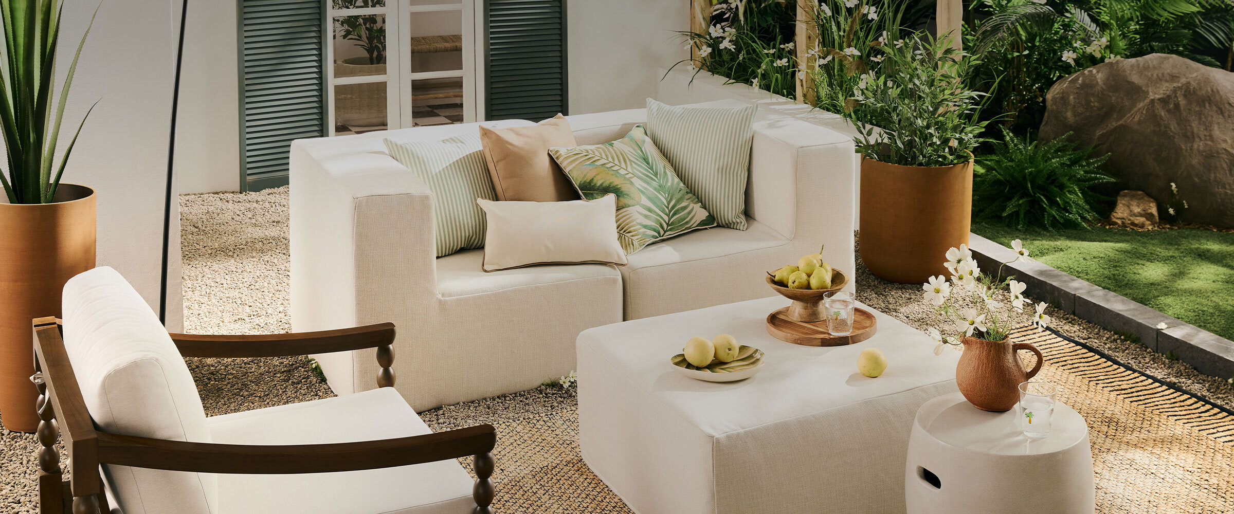 A beautifully appointed patio that invites you to enjoy the simple pleasures of summer