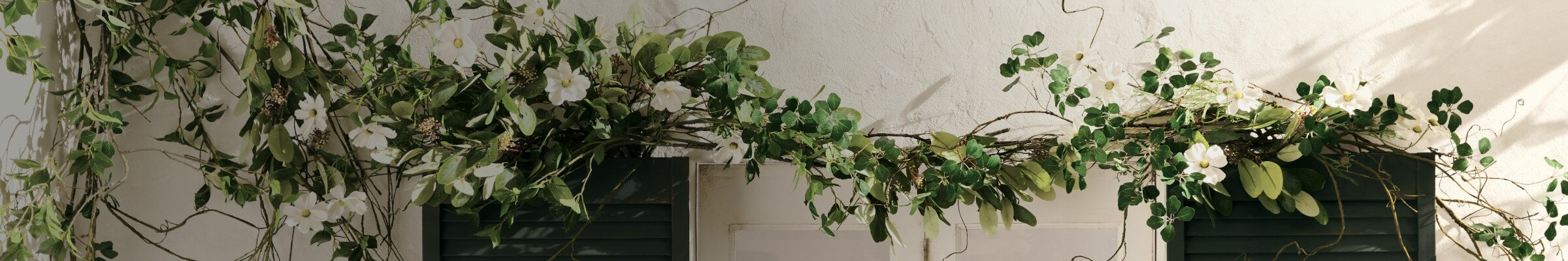 White background with a garland of flowers