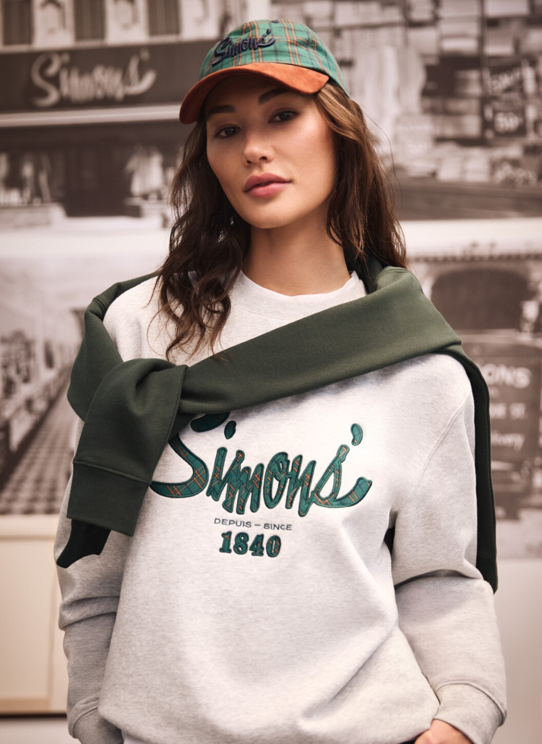 Woman wearing a signature sweatshirt