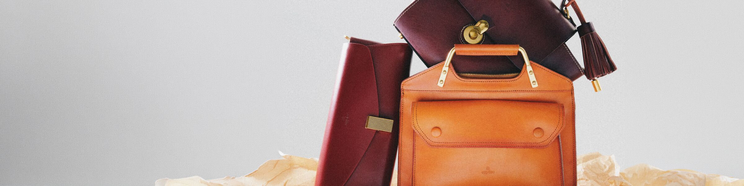 Three leather handbags