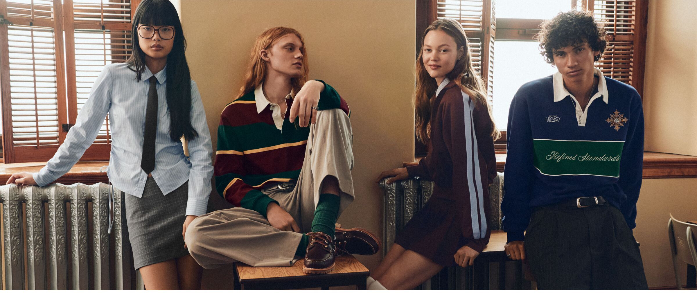 Photo of four young adults in back to school clothes