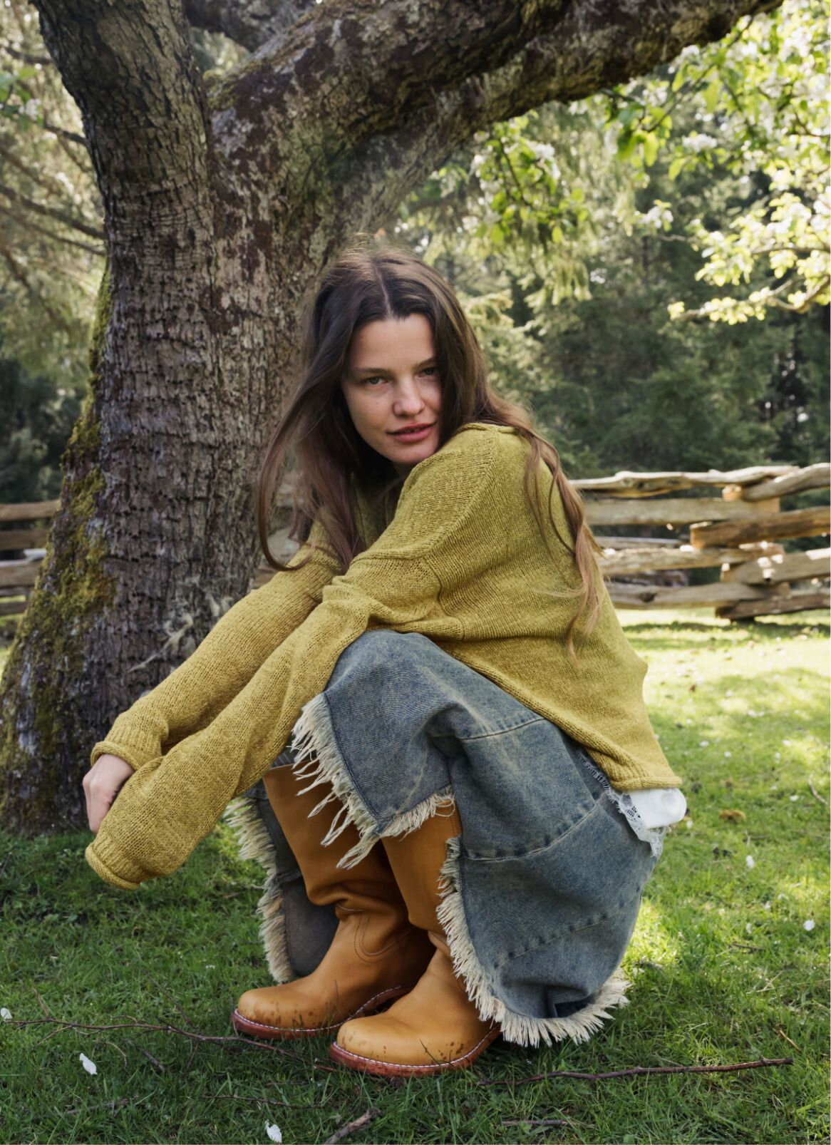 Young woman below a tree
