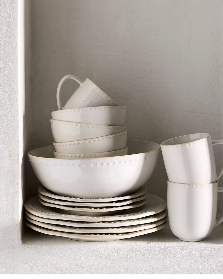 Embossed polka dots large white plate at Simons Maison