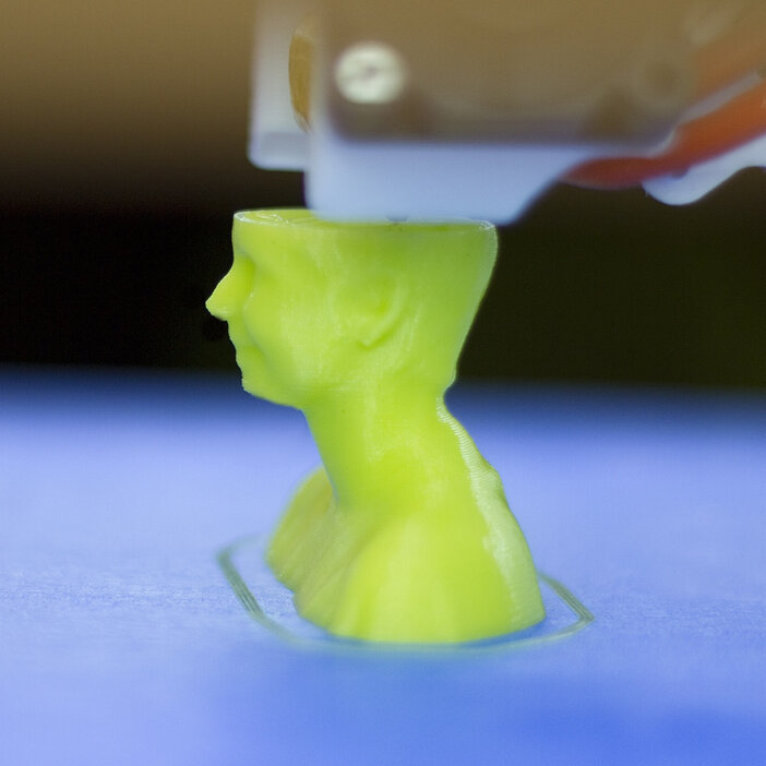 Close-up of the profile of a bust being printed