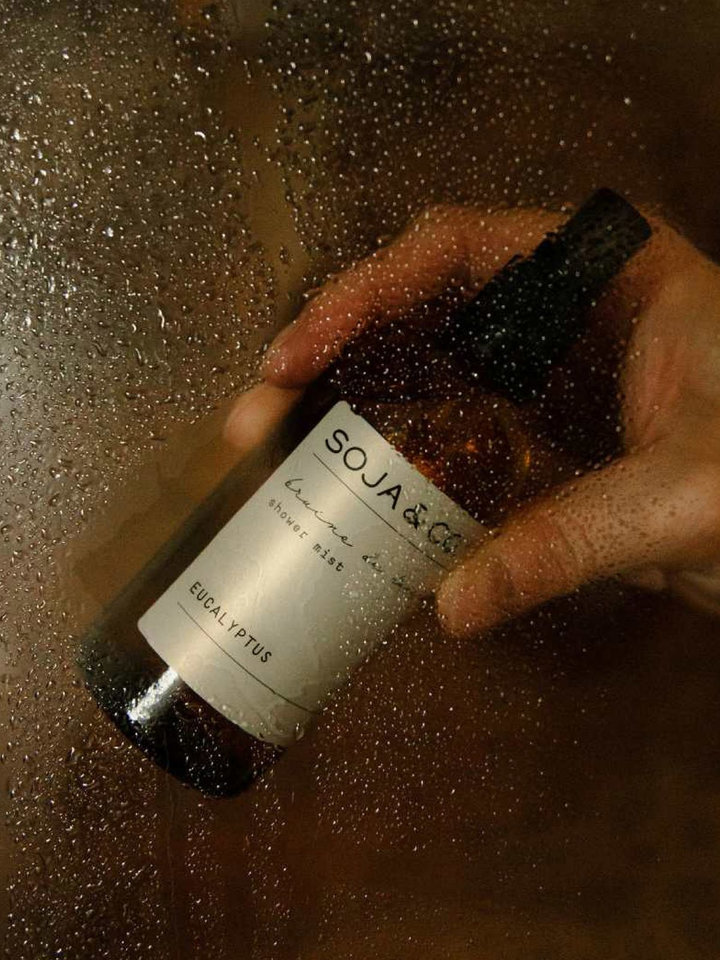 Hand with a shower mist bottle